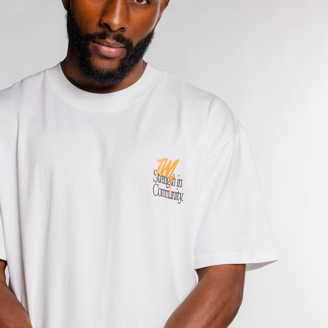 TWL - LIFESTYLE OVERSIZE T-SHIRT - STRENGTH IN COMMUNITY - FADED WHITE/ORANGE